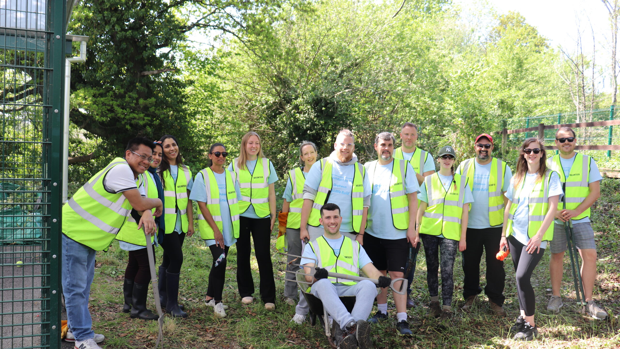 Group of volunteers helping n the garden