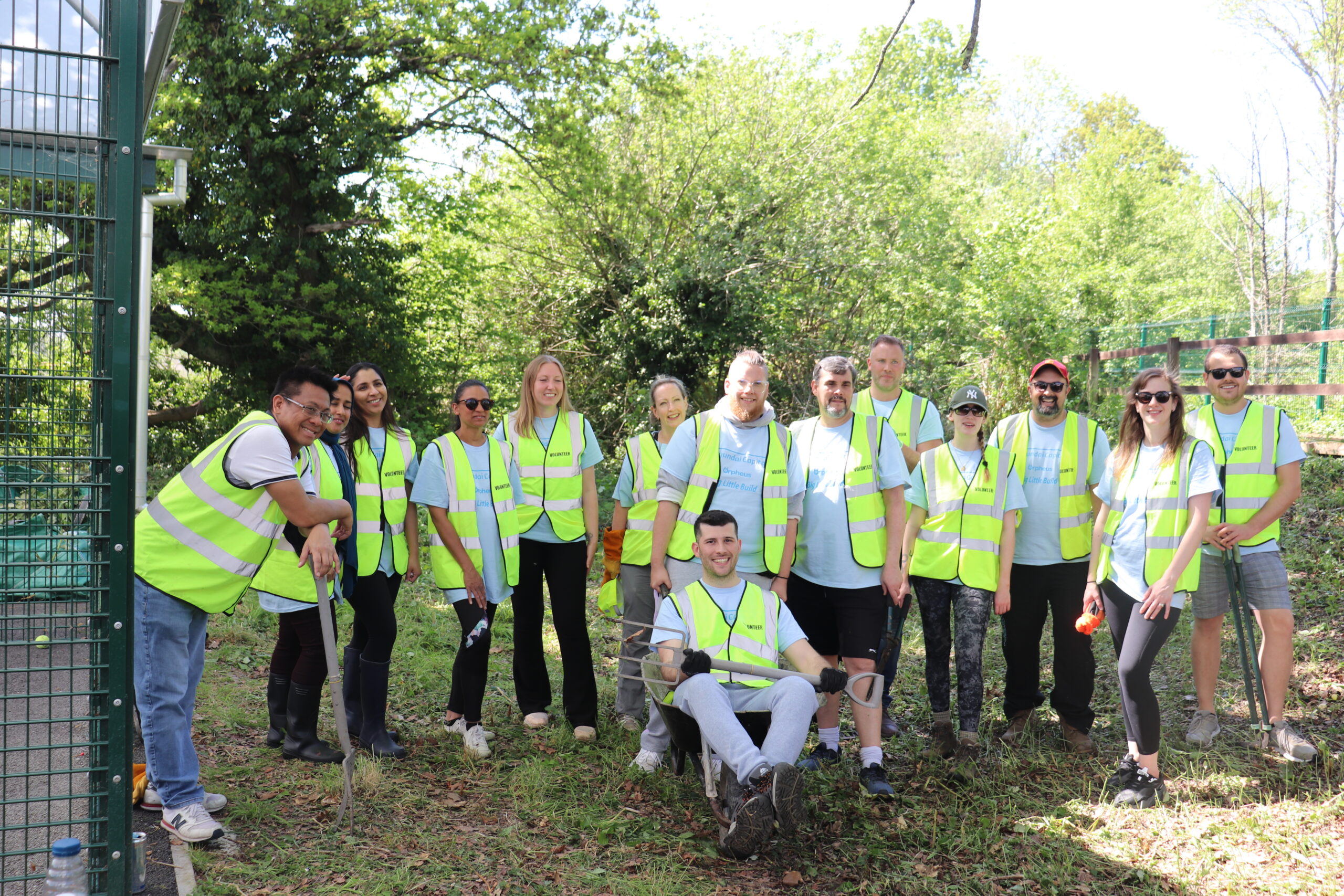 Group of volunteers helping n the garden