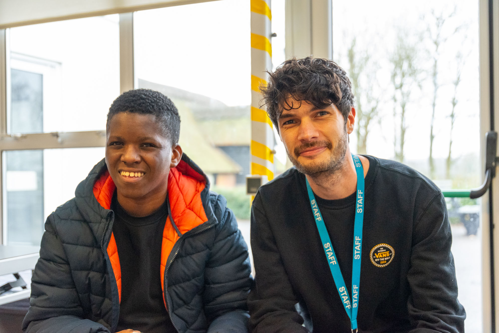 Staff and Student smiling