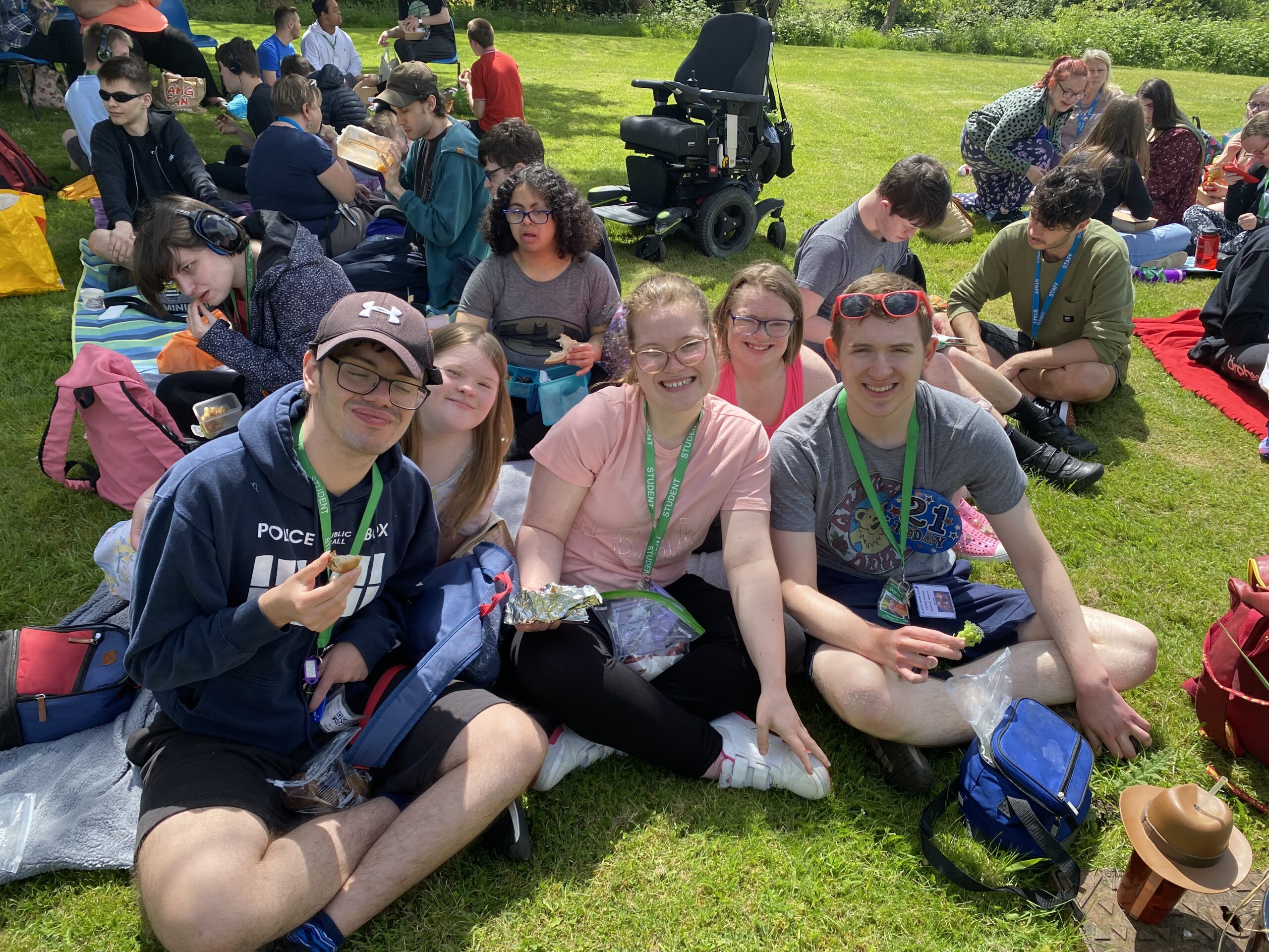 Group of students smiling on the lawn