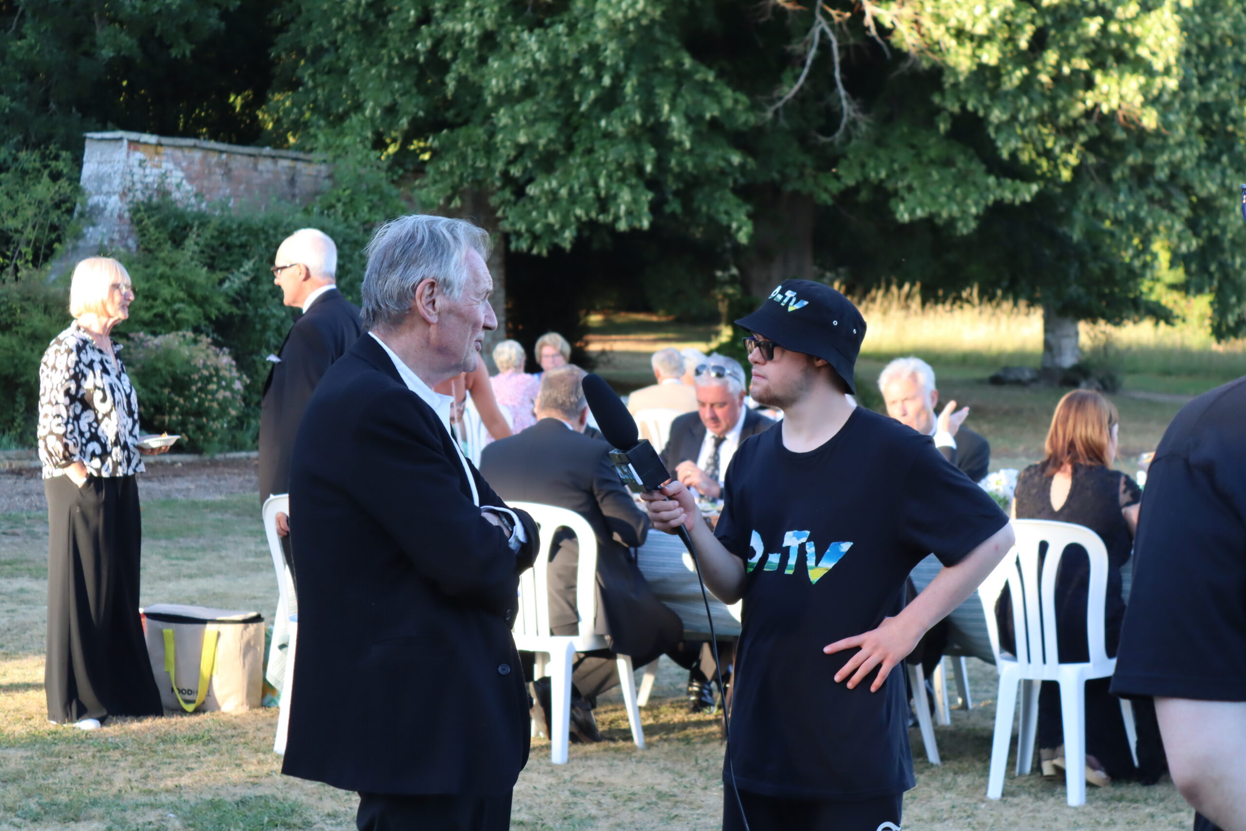 Student interviewing Sir Michael Palin