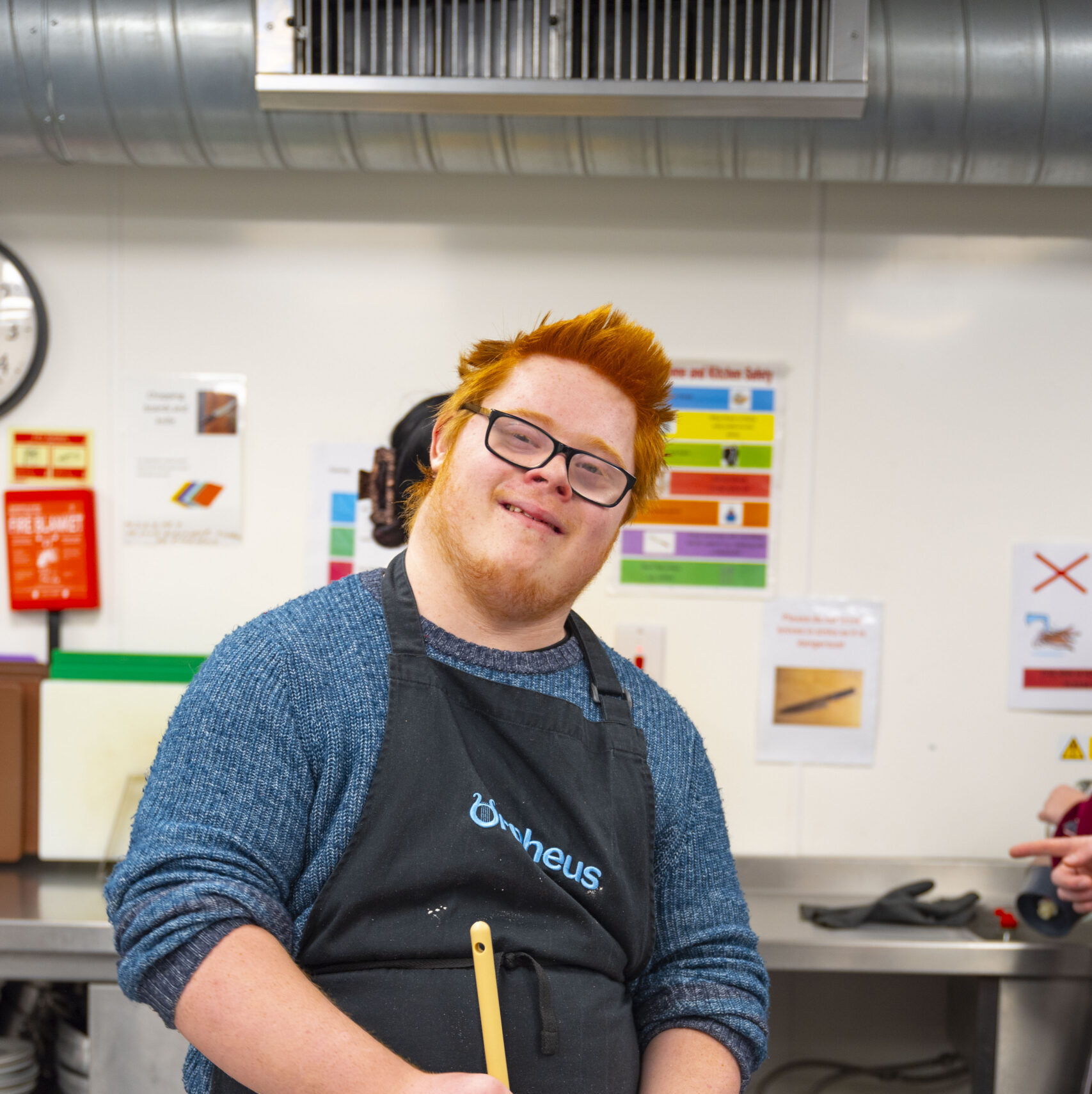 Student learning a recipe, mixing food in a bowl
